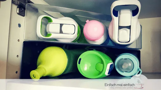 Simple space-saving hacks 4 Several water bottles arranged in magazine folders.