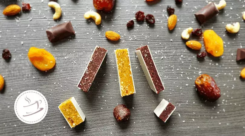 Homemade fruit bars - 1 recipe and 3 variations 3 fruit bars and ingredients on a wooden plate