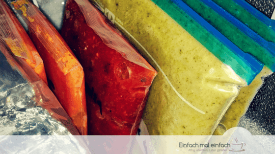 Simple space-saving hacks 2 Freezer bags with colorful contents frozen flat and stacked like books