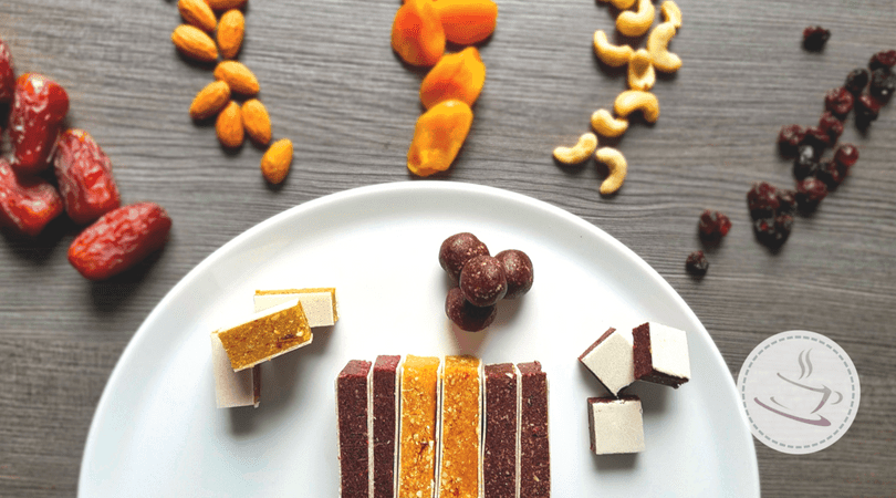 Homemade fruit bars - 1 recipe and 3 variations 2 fruit bars and ingredients on and next to a plate